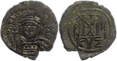 Ancient Coins Münzen Byzanz 610-613, Bronze-Follis, Heraclius, Kyzikus. Av: Büste mit Helm, Pedilienkrone, Schild und Kreuzglobus von vorn. Rev: Großes Wertzeichen "M", darüber Kreuz, daneben A/N/N/O,