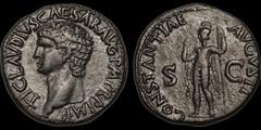 Roman Imperial Claudius. A.D. 41-54. Æ as. 12.39 gm. 27.5 mm. Rome mint. Struck A.D. 41-42. His bare head left; TI CLAVDIVS CAESAR AVG P M TR P IMP / Constantia standing left, raising hand and holding
