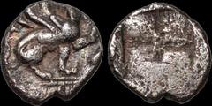 Greek IONIA. Teos. Circa 450-425 B.C. AR hemiobol. .36 gm. 8 mm. A seated griffin, right, raising front left paw / Four part square. SNG Cop 1442. Good Very Fine; old toning; sharp high relief griffin