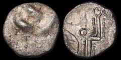 Celtic Britain CELTIC BRITAIN. South Western Region, Durotriges. 1st Century B.C. AR unit. .68 gm. 12 mm. Vestiges of the "three men in a boat" design / A geometric design, a "zigzag" line with dotted