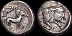 Greek SICILY. Gela. Circa 480/75-475/70 B.C. AR tetradrachm. 16.76 gm. 25 mm. Charioteer driving biga right, holding kentron and reins; above, Nike flying right, crowning horses / Forepart of man-head