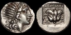 Greek ISLANDS OFF CARIA. Rhodos. Rhodes. Circa 170-150 B.C. AR drachm. 2.34 gm. 15 mm. 'Plinthophoric' coinage. Dexikrates, magistrate. Radiate head of Helios right / Rose with bud to right; winged ke