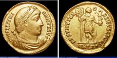 Ancient Coins Valentinian I. Au solidus. Antioch. C, 364-367 AD Rev; RESTITVTOR REPVBLICAE; Valentinian standing facing, holding labarum ornamented with Christogram and Victory on globe. ANTΓ° in ex. 
