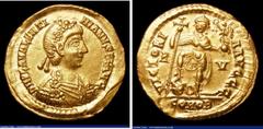 Ancient Coins Valentinian III. Au solidus. Ravenna. C, 426-430 AD. Rev; VICTORIA AVGGG, emperor standing l., holding long cross and Victory on globe; he places foot on head of human-headed coiled serp