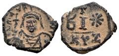 Byzantine Empire Mauricius Tiberius. 10 nummi. 582-602 AD. Cyzicus. (MIBE-522c (but officina not)). (Doc-56). Anv.: Helmeted and cuirassed bust facing, holding globus cruciger and shield . Rev.: Large