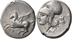 Greek CORINTHIA. Corinth. Circa 375-300 BC. Stater (Silver, 23 mm, 8.74 g, 6 h). Ϙ Pegasus flying left. Rev. Head of Athena to left, wearing Corinthian helmet; below, AΛ; behind neckguard, wheel. BCD 