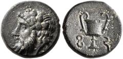 Greek LYDIA. Sardes (?). 4th century BC. Chalkous (Bronze, 12 mm, 1.71 g, 1 h). Head of Dionysos to left, wearing wreath of ivy and fruit. Rev. 𐤮- 𐤱 ('s-f' in Lydian) Kantharos. Brackmann, Autonome 