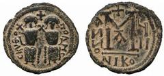 Byzantine No.: 249 Estimate: £ 350.- Arab-Byzantine, after 641, Follis, Scythopolis, CKYQO-POLHC, seated emperor and empress in style of Justin II and Sophia, rev large M flanked by ANNO (retro) and d
