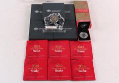 COLLECTIONS & MIXED LOTS AUSTRALIA Lunar coins 2012 50c UNC Tetra-Deagon Year of the Dragon (5). 2013 50c UNC Year of the Snake card (6). Silver proofs 2001 Year Snake ½oz Silver (box deteriorated). 2