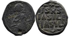 Byzantine Byzantine. Anonymous (attributed to Constantine IX), c. 1042-1055. AE Follis Constantinople. Obv. Nimbate Christ seated facing on throne with back; wearing pallium and colobium and holding b