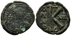 Byzantine Coins Justinian I, AD 527-565. AE Half Follis (28mm, 11.42g). Constantinople. Dated RY 13 (539/40). D N IVSTINIANVS P P AVG. Helmeted and cuirassed bust facing, holding globus cruciger and s