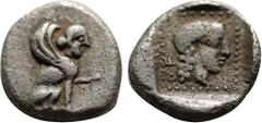 Greek Coins DYNASTS OF LYCIA. Uvug (Circa 470-440 BC). Obol. Uncertain mint. Obv: Sphinx seated right, raising forepaw. Rev: Female head right within pelleted square border; all within incuse square. 
