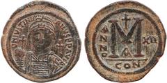 Byzantine Coins JUSTINIAN I (527-565). Follis. Constantinople. Dated RY 12 (538/9). Obv: D N IVSTINIANVS P P AVG. Helmeted and cuirassed bust facing, holding globus cruciger and shield decorated with 