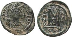 Byzantine Coins JUSTINIAN I (527-565). Follis. Constantinople. Obv: D N IVSTINIANVS P P AVC. Helmeted, draped and cuirassed bust facing, holding globus cruciger and shield; cross in right field. Rev: 