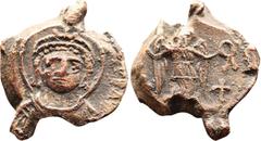 BYZANTINE LEAD SEALS Byzantine Lead Seal Lustinianus I (527-565) Obverse, bust of Lustinian I, frontal, with halo, without beard. Diadem with a helmet and trifolium and pendilia on its head. He wears 
