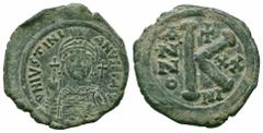 Byzantine Coins JUSTINIAN I.527-565 AD.Nicomedia Mint.AE Half Follis Obverse : D N IVSTINIANVS P P AVG; Helmeted and cuirassed bust facing, holding globus cruciger and shield decorated with horseman m