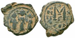 Byzantine Coins HERACLIUS. HERACLIUS CONSTANTINE and MARTINA.610-641 AD.Constantinople Mint.AE Follis Obverse : Heraclius, in center, flanked by Martina, on left, and Heraclius Constantine, on right, 