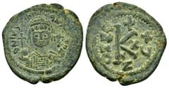 Byzantine Coins JUSTINIAN I.(527-565).Cyzicus.Half Follis. Obv : D N IVSTINIANVS P P AVC. Helmeted and cuirassed bust of Justinian I facing, holding globus cruciger in his right hand and shield over h
