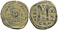 Byzantine Coins JUSTINIAN I.(527-565).Constantinople.Follis. Obv : D N IVSTINIANVS P P AVC. Helmeted, cuirassed bust facing, holding cross on globe and shield with horseman motif, cross to right. Rev 