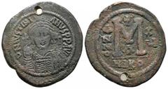 Byzantine Coins JUSTINIAN I.(527-565).Nicomedia.Follis. Obv : DN IVSTINIANVS PP AVG. Helmeted, cuirassed bust facing, holding cross on globe and shield with horseman motif, cross to right. Rev : Large