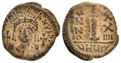 Byzantine Coins JUSTINIAN I.(527-565).Antioch.Decanummium. Obv : D N IVSTINIANVS P P AV. Helmeted and cuirassed bust facing, holding globus cruciger and shield decorated with horseman motif; cross to 