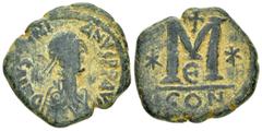 Byzantine Coins JUSTINIAN I.(527-565).Constantinople.Follis. Obv : D N IVSTINIANVS PP AVG. Diademed, draped and cuirassed bust right. Rev : Large M, star left, cross above, star right, E below, mintma