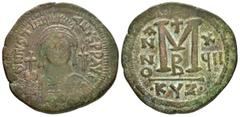 Byzantine Coins JUSTINIAN I.(527-565).Cyzicus.Follis. Obv : D N IVSTINIANVS P P AVG. Helmeted and cuirassed bust facing, holding globus cruciger and shield decorated with horseman motif; cross to righ