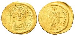 Byzantine Coins JUSTINIAN I.(527-565).Constantinople.Solidus. Obv : D N IVSTINIANVS P P AVG. Helmeted and cuirassed bust facing, holding globus cruciger and shield decorated with horseman motif. Rev :