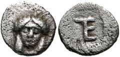 IONIA, Kolophon. Circa 450-410 BC. AR Tetartemorion (6mm, 0.22 g, 10h). Facing head of Apollo / TE (tetartemorion) monogram in incuse square. Milne, Colophon 7; SNG Kayhan 356; SNG von Aulock 1999; Ro