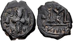 ISLAMIC, Umayyad Caliphate. Uncertain period (pre-reform). AH 41-77 / AD 661-697. Æ Follis (18mm, 3.75 g, 6h). Uncertain mint. Byzantine-style emperor standing facing, holding long cross and globus cr