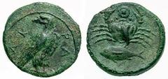 SICILY, Akragas Estimate $300 SICILY, Akragas . Circa 425-406 BC. Æ Onkia (3.20 gm). AK-PA, eagle standing right, with head reverted, on a fish / Crab, fish left below; pellet within a circle between 