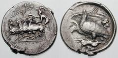 SICILY, Akragas Estimate $7500 SICILY, Akragas. Circa 409-406 BC. AR Tetradrachm (17.46 gm). AKRAGANT[I-NON] in exergue, Nike driving galloping quadriga left, holding kentron in left hand, reins in bo