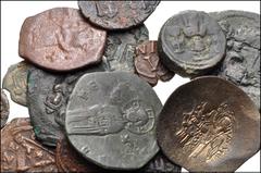 BYZANTINE. Lot of fifteen (15) Æ issues from Justinian I to Manuel I. Includes: Justinian I. Æ Decanummium. Antioch mint // Justinian I. Æ 12 Nummi. Alexandria mint // Maurice Tiberius. Æ Decanummium.