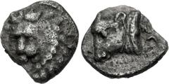 Greek CARIA, Uncertain ('Mint C'). Circa 400-350 BC. AR Tetartemorion (5mm, 0.16 g, 3h). Milesian standard. Head of lion facing slightly left / Head of bull left; Z (in Carian, or symbol?) to right. C