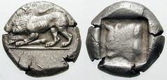 LYCIA, Dynasts of. Uncertain. Estimate $500  LYCIA, Dynasts of. Uncertain. Circa 500-460 BC. AR Stater (9.24 gm). Lion standing left, devouring the leg of another animal / Bull's head left within incu