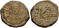 Justinian I. 527-565. Æ Half Follis (23mm, 8.39 g, 6h). Uncertain mint . Dated RY 14 (540/1 AD). Helmeted and cuirassed facing bust, holding globus cruciger and shield / Large K; cross above, date acr