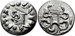 734237. Sold For $225 LYDIA, Tralles. After 133 BC. AR Cistophoric Tetradrachm (25mm, 12.67 gm). Cista mystica with serpent; all within ivy wreath / Bow-case with serpents, TΡAΛ to left, ΔION above, l
