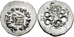 736940. Sold For $225 MYSIA, Pergamon. Circa 133-67 BC. AR Cistophoric Tetradrachm (27mm, 12.69 gm). Struck circa 123-104 BC. Cista mystica with serpent; all within ivy wreath / Bow-case with serpents