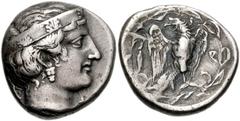 778304. Sold For $2750 ELIS, Olympia. 109th Olympiad. 344 BC. AR Stater (22mm, 12.02 g, 7h). Hera mint. Head of Hera right, wearing narrow stephanos ornamented with four palmettes / Eagle with open wi