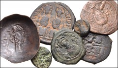 BYZANTINE. Lot of seven (7) bronze and billon issues from Justin II to Isaac II. Includes: Justin II & Sophia. Æ Follis // Æ Half Follis // Æ Decanummium // Phocas. Æ Half Follis // Anonymous. Æ Folli