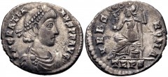Gratian. AD 367-383. AR Siliqua (18mm, 2.07 g, 12h). Treveri (Trier) mint. Struck AD 367-378. Pearl-diademed, draped, and cuirassed bust right / Roma seated left on cuirass, holding crowning Victory o