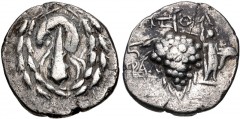 LYDIA, Tralles. Circa 166-67 BC. AR Didrachm (20mm, 5.70 g, 12h). Cistophoric series. Ptol–, magistrate. Struck circa 133-125 BC. Lion’s skin draped over club; all within ivy wreath / Grape bunch on v