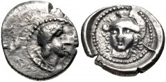 LYCIA, Patara(?). Circa 410-390 BC. AR Diobol (12mm, 0.96 g, 3h). Male head right; E and [caduceus?] to right; all within pelleted circular border / Helmeted head of Athena facing slight left; all wit