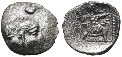 UNCERTAIN LEVANTINE. 4th century BC. AR Tetartemorion (6.5mm, 0.14 g, 10h). Janiform head of Silenos on left, satyr on right, with a third face facing upward from the top / Slinger in throwing stance 