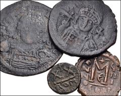 BYZANTINE. Lot of four (4) bronzes. Includes: Justinian I. Æ Follis (2 coins) // Maurice Tiberius. Æ Half Follis. Rome mint // Heraclius. Æ Follis. Constantinople mint. Fine to Near VF, mostly with pa