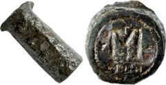 Byzantine Justin I. 518-527. Iron Die for an Æ Follis Reverse. Average dimensions: overall length, 88mm; diameter, 35mm at die face, widening to 40 mm at the center, and tapering to 33mm at striking f