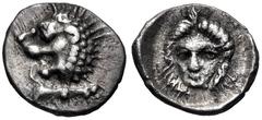 Greek CARIA, Mylasa. Circa 420-390 BC. AR Tetartemorion (6.5mm, 0.22 g, 4h). Milesian standard. Forepart of lion right, head turned back / Head of male (Apollo?) facing slightly left. HN Online 937; S