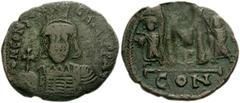 Constantine IV Pogonatus. 668-685. Æ Follis (35mm, 14.36 g). Constantinople mint. Struck 668-673. Helmeted and cuirassed bust facing, holding globus cruciger / Large M, cross above, flanked by Heracli