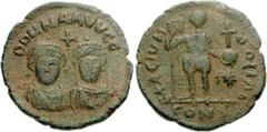 Theodosius II & Valentinian III. AD 425-450. Æ Coin Weight (4.16 g, 7h). Constantinople mint. Struck circa AD 426. D D N N AAVVGG, helmeted and draped facing busts of Arcadius and Honorius; cross abov