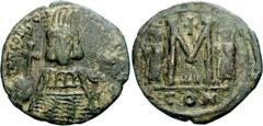 Constantine IV Pogonatus. 668-685. Æ Follis (16.97 g, 6h). Constantinople mint, 4th officina. Struck circa 668-673. Helmeted facing bust, holding globus cruciger / Large M flanked by Heraclius and Tib